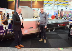 Herman van der Jagt and Mark Hogenboom of Hans van der Poel at the newest flower machine of the company.